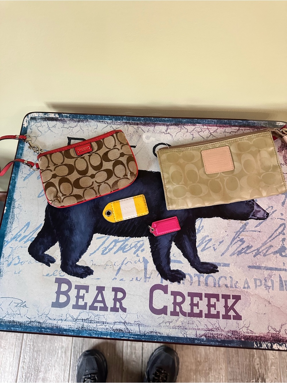 Coach two hang tags and two Signature Wristlet